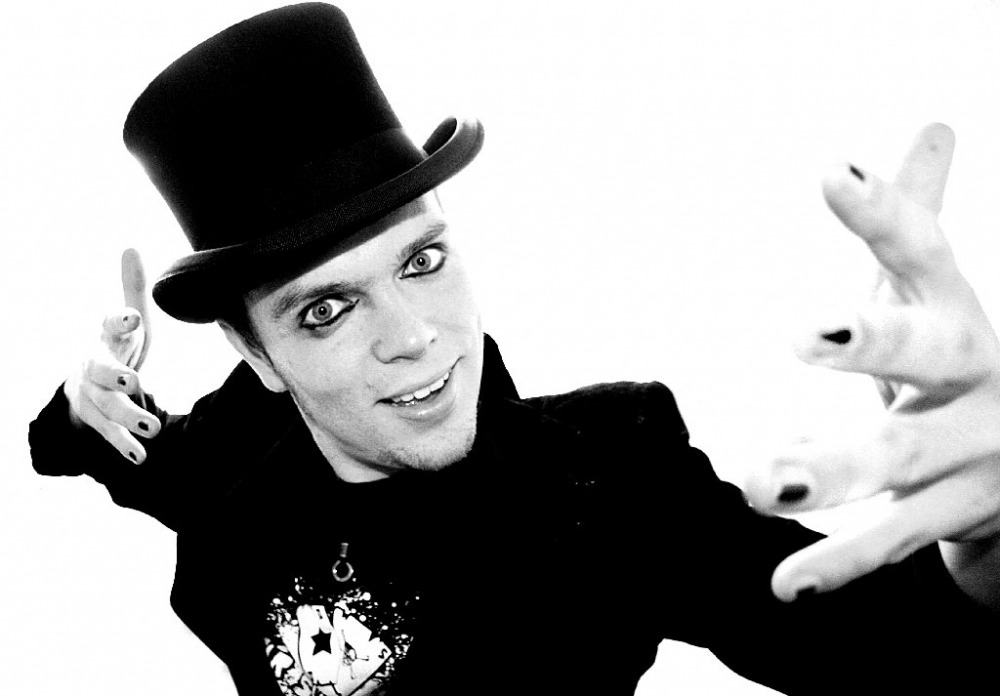 Black and white character portrait of a performer in a top hat