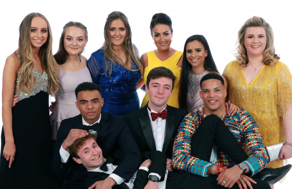A group of students dressed up together at their school prom